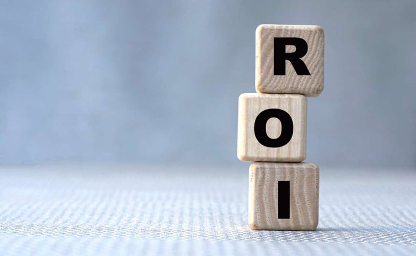 ROI spelled in wooden blocks