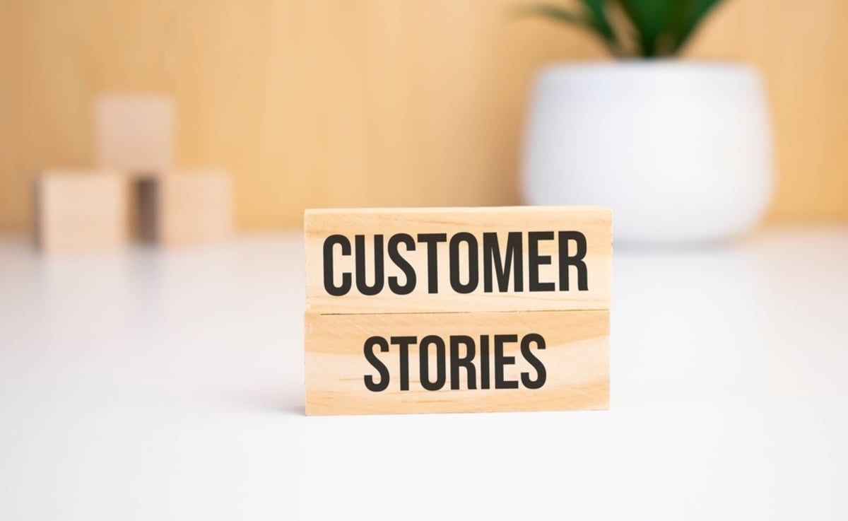 Wooden blocks that say customer stories